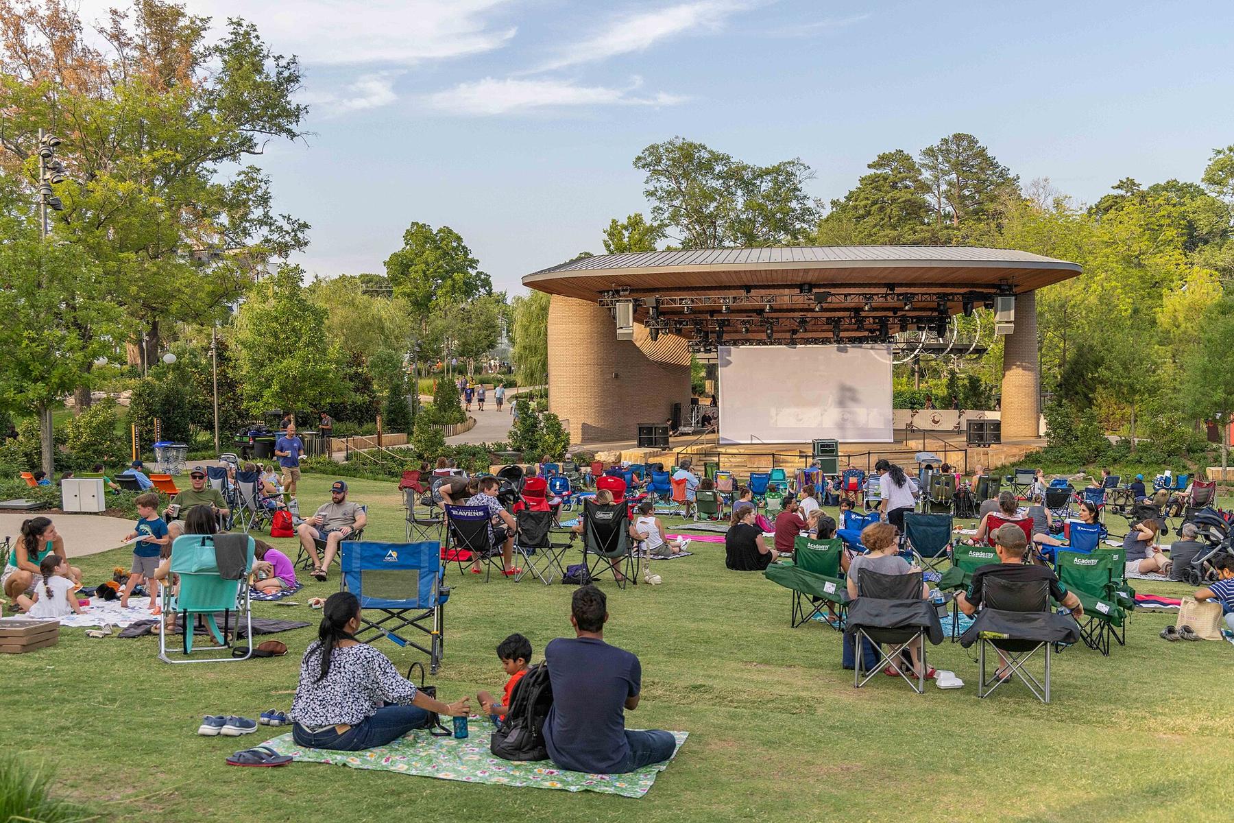 Neighbors on a lawn at an outdoor concert